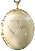 25 oval locket with two hearts