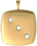 gold pillow locket with 3 stones